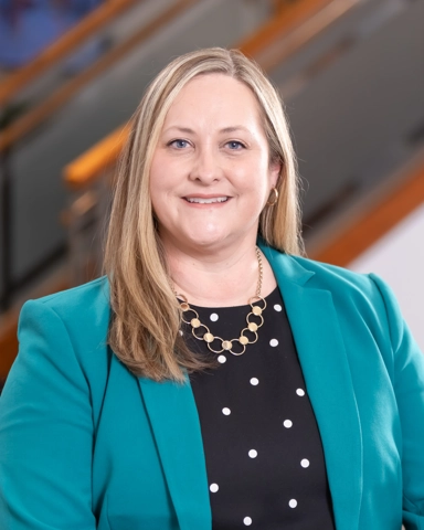 portrait of a smiling person in professional attire